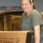 Packing, sorting, assembly and other contract services work puts smiles on faces and money in the pockets of people with disabilities (photo courtesy of Paige Connors, American Training, Inc.)